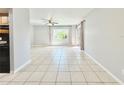 Bright living room featuring tile flooring, a ceiling fan, and natural light at 601 N Keene Rd # P9, Clearwater, FL 33755
