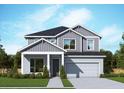 Two-story home featuring a modern design, well-manicured lawn, and integrated two-car garage at 11884 Richmond Trl, Parrish, FL 34219