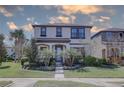 Charming two-story home with a well-manicured lawn and inviting front entrance at 12421 Triple Creek Blvd, Riverview, FL 33579