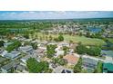 An aerial photograph shows a well-planned residential community with golf course, lakes, and lush landscaping at 13122 Prestwick Dr, Riverview, FL 33579