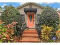 Inviting front door with decorative wreath, plants and brick steps, secured by ADT at 138 17Th N Ave, St Petersburg, FL 33704