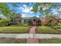 Quaint single-story home featuring a lovely front lawn and inviting brick path at 138 17Th N Ave, St Petersburg, FL 33704