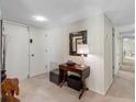 Neutral entryway featuring a console table, mirror, and carpeted flooring at 1430 Gulf Blvd # 309, Clearwater Beach, FL 33767