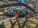 Charming home with mature landscaping and shade trees providing privacy at 223 Lime S Cir, Dunedin, FL 34698