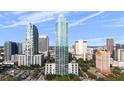Exterior aerial view showcasing the building's modern architecture within a city skyline at 777 N Ashley Dr # 2610, Tampa, FL 33602
