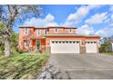 Charming two-story home with a front-facing two-car garage and a beautifully maintained lawn at 9102 Kentucky Day Ct, Gibsonton, FL 33534