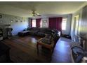 Inviting living room with hardwood floors, modern lighting, and a comfortable seating area at 1448 Lemon St, Clearwater, FL 33756