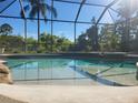 A pristine swimming pool featuring clear blue water and a -friendly beach entry at 21654 Draycott Way, Land O Lakes, FL 34637