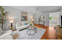 Bright living room with hardwood floors, stylish furniture, and contemporary decor elements for a modern feel at 3409 W El Prado Blvd, Tampa, FL 33629