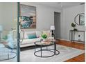 The light-filled living room is decorated with comfortable seating and is ready to entertain your guests at 3409 W El Prado Blvd, Tampa, FL 33629