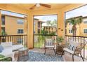 Relaxing outdoor balcony with comfortable seating and views of the surrounding complex at 4323 Bayside Village Dr # 229, Tampa, FL 33615