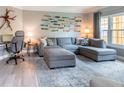 Comfortable living room boasts a plush sectional sofa, stylish decor, and a large window at 4323 Bayside Village Dr # 229, Tampa, FL 33615