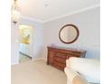 Cozy living room with a wood dresser and neutral colors, providing a comfortable and relaxing atmosphere at 5925 Shore S Blvd # 608, Gulfport, FL 33707
