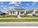 Well-maintained single Gathering home with stone accents and a beautifully landscaped front yard and walkway at 671 Allora Ave, Nokomis, FL 34275