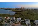 Stunning aerial shot of the house near a beautiful bay, highlighting the coastal lifestyle at 13936 Harbor View Dr, Seminole, FL 33776