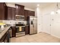 Well-equipped kitchen with stainless steel appliances and ample cabinet space at 10943 Verawood Dr, Riverview, FL 33579