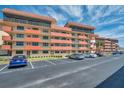 Exterior view of Bay Mariner condo with well-kept grounds and convenient parking, offering a glimpse of community living at 19701 Gulf Blvd # 210, Indian Shores, FL 33785