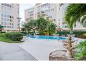 Community pool with lounge chairs and tables for outdoor enjoyment and relaxation at 2401 S Ardson Pl # 503, Tampa, FL 33629