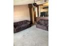 Cozy living room with comfortable seating and neutral carpeting throughout at 3005 W 18Th W Ave, Bradenton, FL 34205