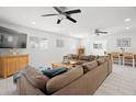 Spacious living room with modern ceiling fans, neutral colors, and comfortable seating at 347 Patica Ne Rd, St Petersburg, FL 33702
