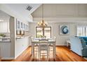 Bright dining room featuring hardwood floors, and a charming chandelier at 400 Westborough Ln, Safety Harbor, FL 34695
