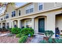 Attractive townhome with a well-maintained lawn and a covered entry, ensuring curb appeal at 4676 66Th N Pl, Pinellas Park, FL 33781