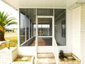 View of the screened in porch showing tile flooring and large opening at 5244 Betty St, Zephyrhills, FL 33542