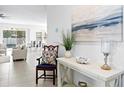 Inviting entryway featuring stylish decor and an open view to the living spaces at 1044 Manzanar Pl, Wesley Chapel, FL 33543