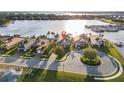 Stunning waterfront property on a canal, featuring lush landscaping and a private boat dock at 1110 Overlook Ct, Bradenton, FL 34208