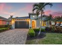 Charming single-Gathering home featuring a brick driveway and a meticulously maintained, landscaped front yard at 1110 Overlook Ct, Bradenton, FL 34208