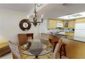 The dining area seamlessly adjoins the kitchen and features seating for four at 12924 Gulf Blvd # 310, Madeira Beach, FL 33708