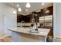 Contemporary kitchen featuring granite countertops, stainless steel appliances, and ample cabinet space at 13217 Canopy Creek Dr, Tampa, FL 33625