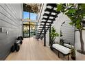 Bright foyer with floating stairs, modern lighting, high ceilings, and a beautiful front door at 3105 S Schiller St, Tampa, FL 33629