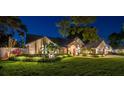 Attractive single-Gathering home with meticulously maintained landscaping, brick accents, and a welcoming front entrance at 3612 Sugar Loaf Ln, Valrico, FL 33596