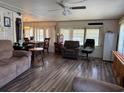 Inviting living room featuring hardwood floors and a cozy atmosphere at 4116 Cardoon Dr, New Port Richey, FL 34653