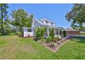 This inviting home features manicured landscaping, a front porch, and well-maintained lawn at 609 4Th Sw Ave, Ruskin, FL 33570