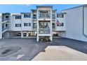 Exterior angle of condo building featuring parking and staircase access to the upper levels at 803 Bahia Del Sol Dr # 66, Ruskin, FL 33570