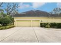 A two-car attached garage showcasing the home's ample parking space and exterior design at 16113 Ternglade Dr, Lithia, FL 33547