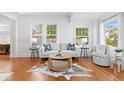 Bright living room with hardwood floors, and a modern round wood coffee table at 1617 Oak Ne St, St Petersburg, FL 33704