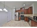 Modern kitchen featuring stainless steel appliances and granite countertops at 2138 Broadway View Ave, Brandon, FL 33510