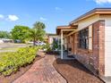 Charming brick home with brick walkway and inviting curb appeal in a quiet neighborhood at 4532 W Idlewild Ave, Tampa, FL 33614