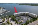 Beautiful waterfront complex with lush landscaping, parking, and stunning water views at 8800 Bay Pines Blvd # 318, St Petersburg, FL 33709