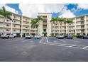 Well-maintained condo building featuring ample parking, lush landscaping, and a convenient entrance for residents at 8800 Bay Pines Blvd # 318, St Petersburg, FL 33709