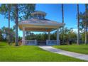 Picturesque gazebo with classic columns and a hexagonal roof, set amidst lush greenery at 10144 Arbor Run Dr # 122, Tampa, FL 33647