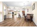 Spacious living room featuring hardwood floors, arched entryways, and ample natural light at 1564 Imperial Key Dr, Trinity, FL 34655