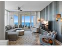 Cozy living room with comfortable seating, city view, and access to a balcony at 175 1St S St # 3008, St Petersburg, FL 33701