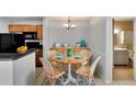 Dining room with seating for four, stylish furnishings and modern light fixture at 209 Lake Brook Cir # 104, Brandon, FL 33511