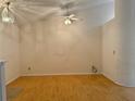 Spacious living room boasts wood floors, vaulted ceilings, and a ceiling fan at 224 Chardonnay Pl, Valrico, FL 33594