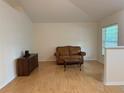 Cozy living room with hardwood floors, comfortable leather sofa, and natural light at 224 Chardonnay Pl, Valrico, FL 33594