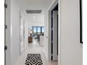 Inviting hallway featuring modern decor, leading to a bright living area with scenic city views at 301 1St S St # 2205, St Petersburg, FL 33701